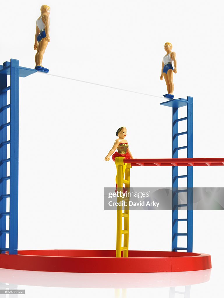 Studio shot of figurines on ladders