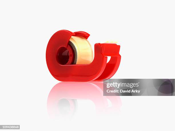 studio shot of adhesive tape - tape dispenser photos et images de collection