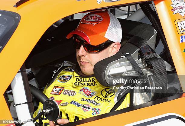 Kyle Busch, driver of the Combos Toyota, sits in his car during practice for the Subway Fresh Fit 500 at Phoenix International Raceway on February...