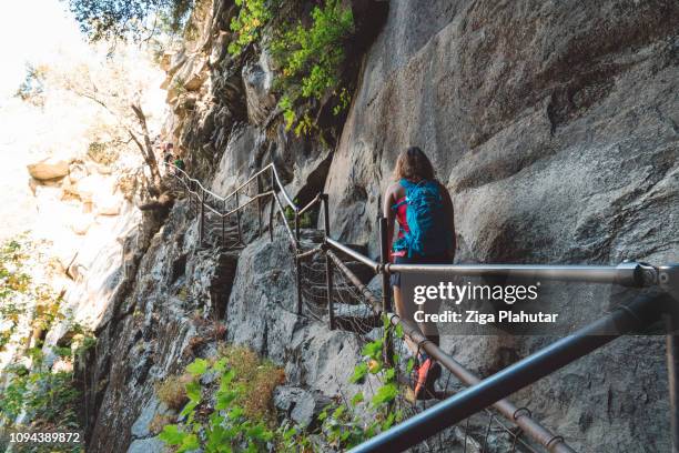 woman hiker walking on vernal falls trailhead - vernal falls stock pictures, royalty-free photos & images