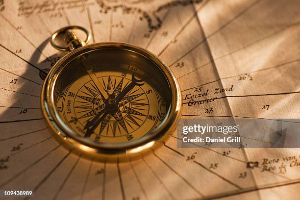 Paper Map Compass Paper Map Compass Photos and Premium High Res Pictures - Getty Images