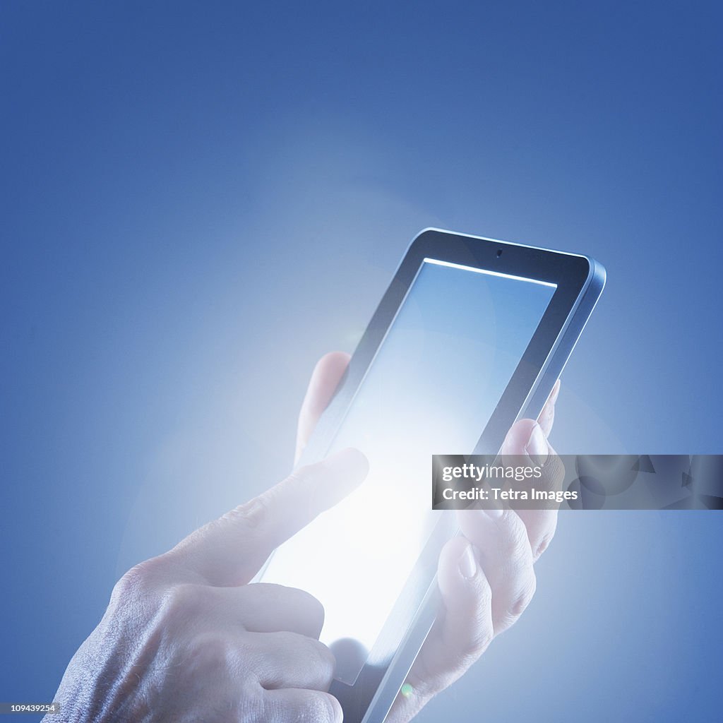 Young woman's hands using digital tablet