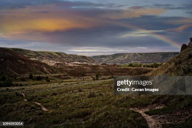scenic view of landscape against cloudy sky during sunset - fort mcmurray stock pictures, royalty-free photos & images