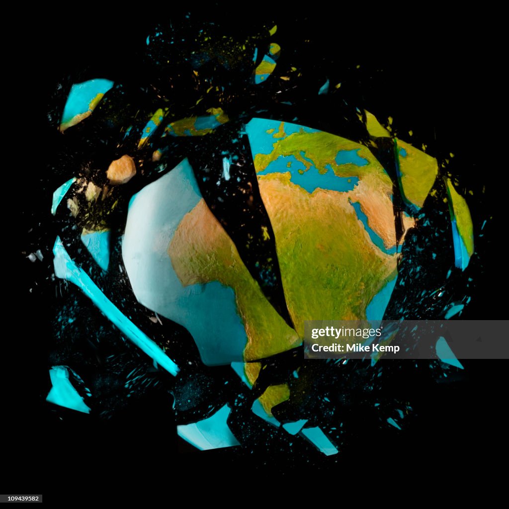 Exploding globe on black background
