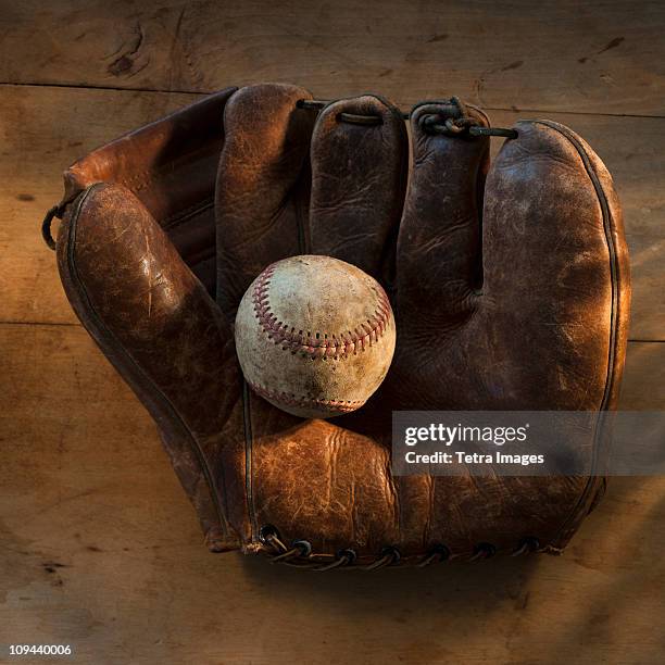 antique baseball on baseball glove with bat - baseball glove antique fotografías e imágenes de stock