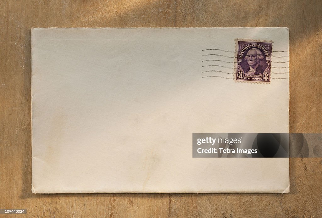 Blank envelope on wooden table