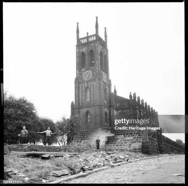 St Mary's Church, St Mary's Street, Quarry Hill, Leeds, 1966-1974. Three boys playing on the derelict remains of a structure to the west of the...