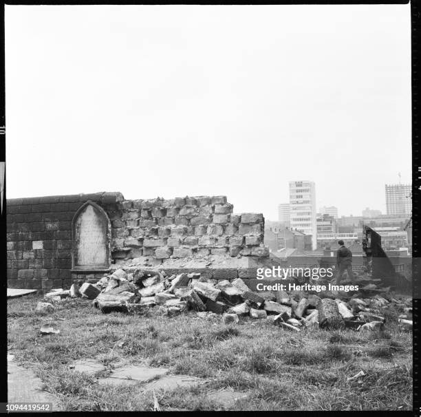 St Mary's Church, St Mary's Street, Quarry Hill, Leeds, 1966-1974. A boy walking through the demolished stonework of the the graveyard wall at St...