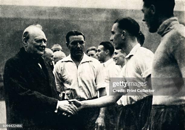 Association Football at Wembley - England v. Scotland', 4 October 1941, . British Prime Minister Winston Churchill shakes hands with England...