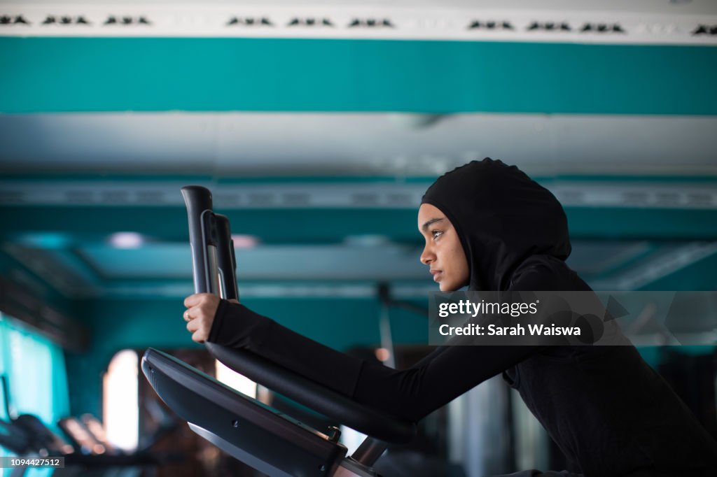 Woman in a hijab working out