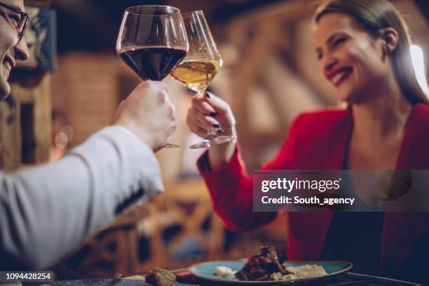 couple having a romantic night - wine dinner stock pictures, royalty-free photos & images
