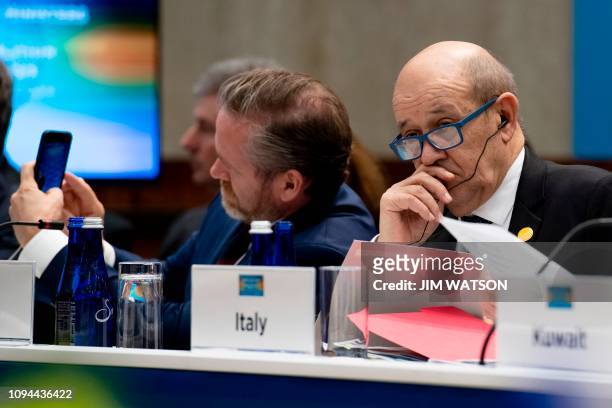 Danish Minister for Foreign Affairs Anders Samuelsen and French Foreign Minister Jean-Yves Le Drian attend the Meeting of the Ministers of the Global...