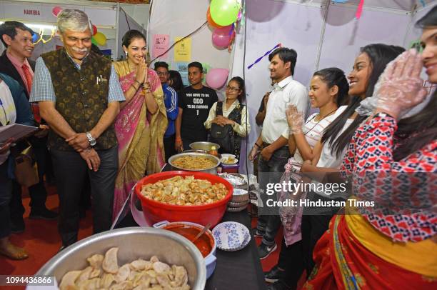 Vice Chancellors Nitin Karmalkar, and winner of the Miss World 1999 pageant and Bollywood actor Yukta Mookhey visit food stalls during International...