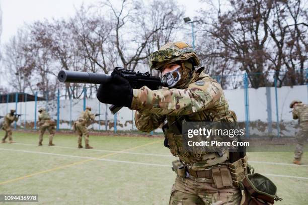 Members of paramilitary group Azov Battalion are training in a base, a former holiday resort near Mariupol as the Azov batallion re-join the...