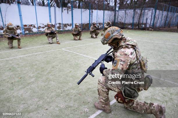 Members of paramilitary group Azov Battalion are training in a base, a former holiday resort near Mariupol as the Azov batallion re-join the...