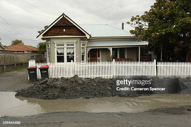 Sunken house due to liquefaction in Avonside on February 26, 2011 in Christchurch, New Zealand. The death toll has risen to 145 and the hope for...