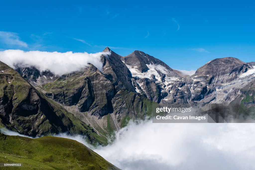 Scenic view of Grossglockner against blue sky during sunny day