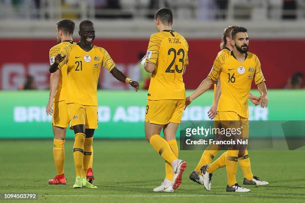 Awer Mabil celebrates with Tomas Rogic after scoring the opening goal during the AFC Asian Cup Group B match between Australia and Syria at Khalifa...