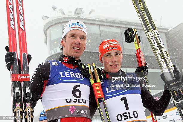 Medallists Eric Frenzel and Tino Edelmann of Germany celebrate following the Nordic Combined Individual 10KM Cross Country race during the FIS Nordic...