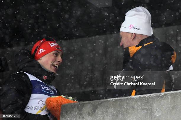 Gold medallist Eric Frenzel of Germany is congratulated by King Harald V of Norway following the Nordic Combined Individual 10KM Cross Country race...