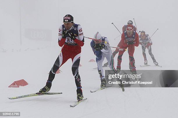 Mario Stecher of Austria leads a group in the Nordic Combined Individual 10KM Cross Country race during the FIS Nordic World Ski Championships at...