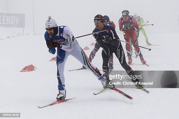 Giuseppe Michielli of Italy leads a group in the Nordic Combined Individual 10KM Cross Country race during the FIS Nordic World Ski Championships at...