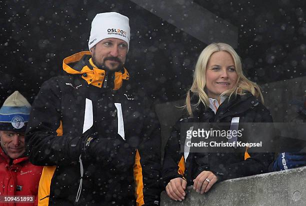 Crown Prince Haakon of Norway and Crown Princess Mette-Marit of Norway attend the Nordic Combined Individual 10KM Cross Country race during the FIS...