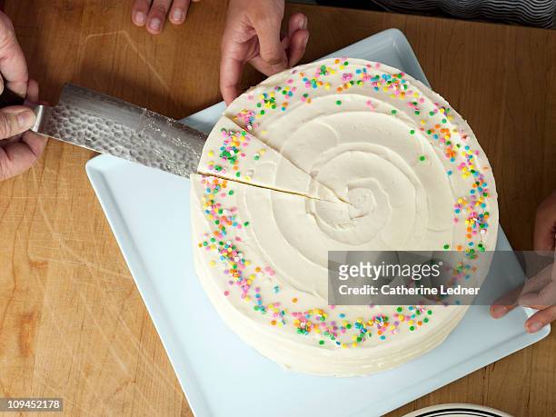 cutting a decorative cake - cake slices stock-fotos und bilder