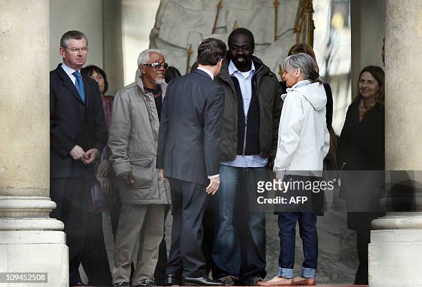 French president Nicolas Sarkozy escorts freed French hostages, Françoise Larribe , Madagascar's Jean-Claude Rakotorilalao and Togo's Alex Kodjo...