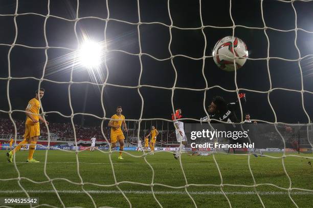 Tomas Rogic of Australia scores the winning goal as goalkeeper Ibrahim Alma of Syria dives in vain during the AFC Asian Cup Group B match between...