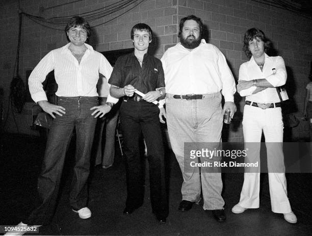 Promoter Alex Cooley with ELP's Greg Lake, Carl Palmer and Keith Emerson of Emerson, Lake and Palmer backstage at The OMNI Coliseum in Atlanta...