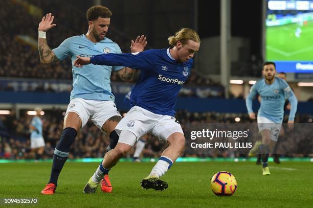 Everton's English midfielder Tom Davies vies against Manchester City's English defender Kyle Walker during the English Premier League football match...