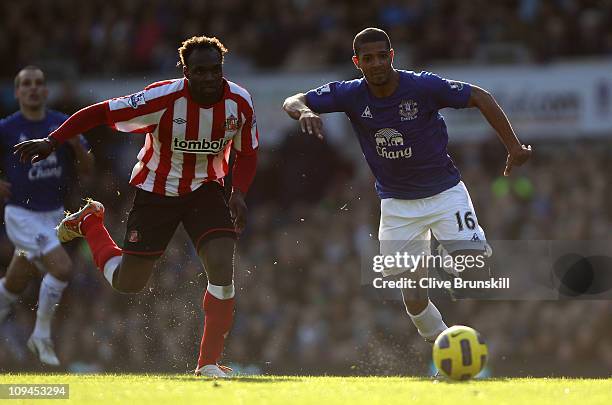 Jermaine Beckford of Everton attempts to move forward with the ball against John Mensah of Sunderland during the Barclays Premier League match...