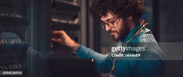 server rooms - computer network technician stock pictures, royalty-free photos & images