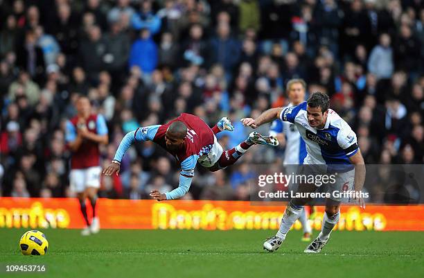 Ryan Nelson of Blackburn takes out Ashley Young of Aston Villa during the Barclays Premier League match between Aston Villa and Blackburn Rovers at...