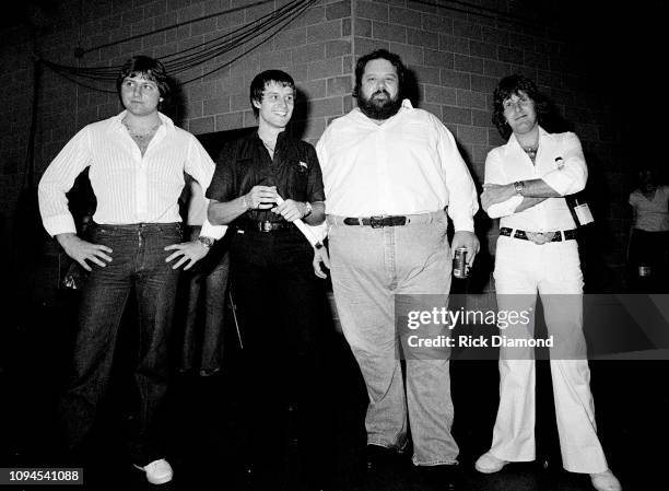 Promoter Alex Cooley with ELP's Greg Lake, Carl Palmer and Keith Emerson of Emerson, Lake and Palmer backstage at The OMNI Coliseum in Atlanta...