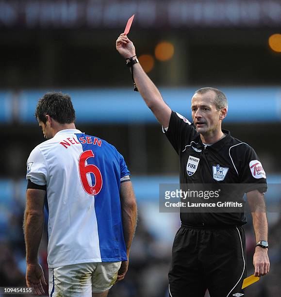 Ryan Nelsen of Blackburn Rovers receives a Red Card from Referee Martin Atkinson during the Barclays Premier League match between Aston Villa and...