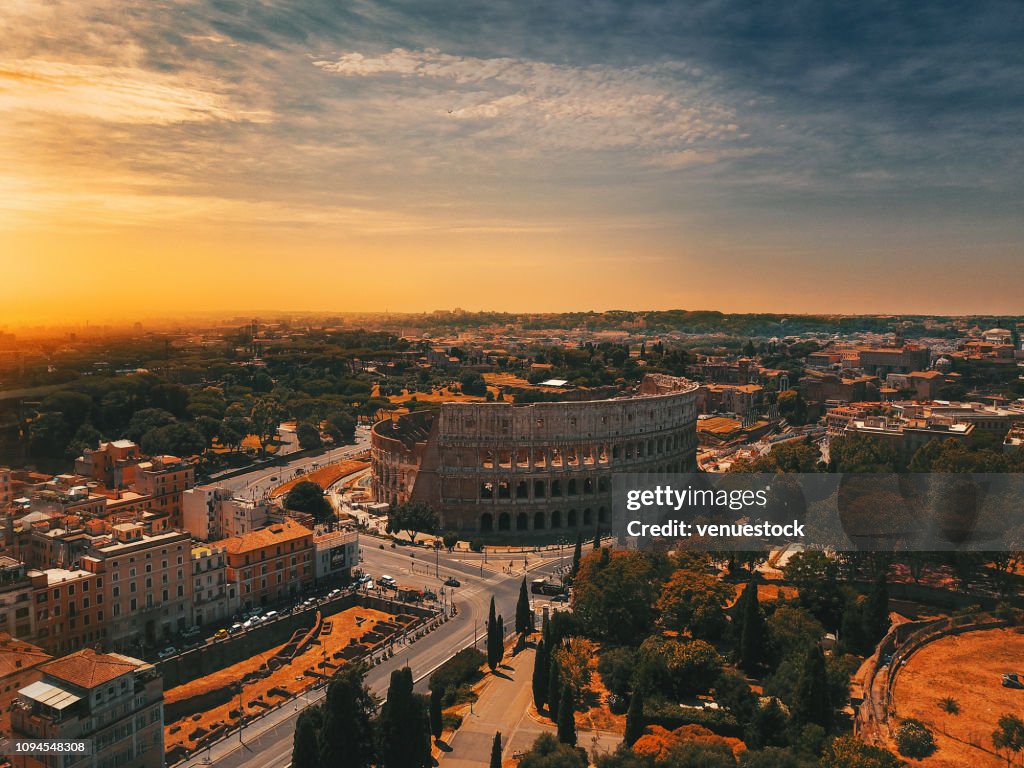 Colosseum in Rome and morning sun, Italy