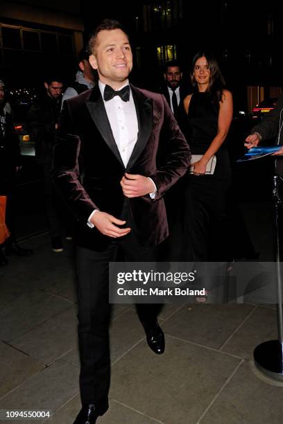 Taron Egerton and Emily Thomas attend the dunhill Pre-BAFTA dinner at dunhill Bourdon House on February 6, 2019 in London, England. )