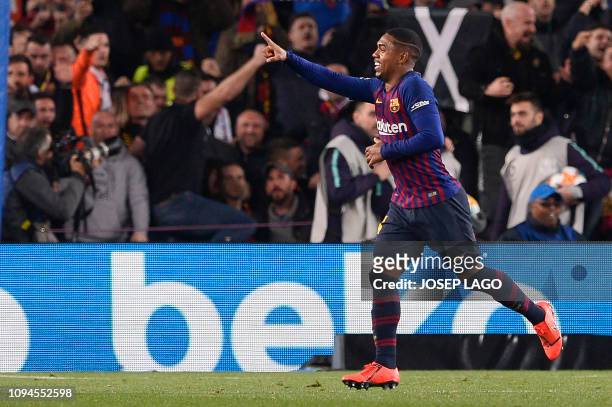 Barcelona's Brazilian midfielder Malcom celebrates his goal during the Spanish Copa del Rey semi-final first leg football match between FC Barcelona...