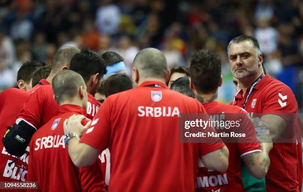Nenad Perunicic, head coach of Serbia looks on with his players during the 26th IHF Men's World Championship group A match between Korea and Serbia...