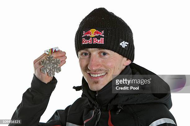 Adam Malysz of Austria poses with the bronze medal won in the Men's Ski Jumping HS106 competition during the FIS Nordic World Ski Championships at...