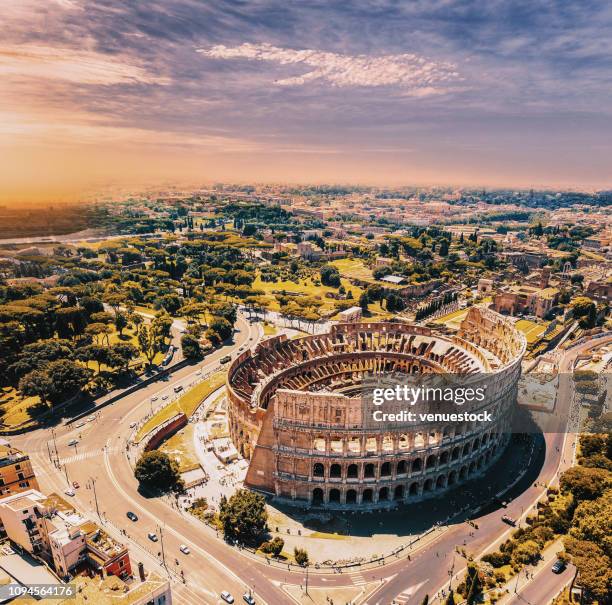 colosseum in rome and morning sun, italy - rome italy stock pictures, royalty-free photos & images