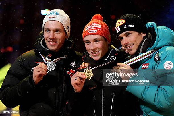 Medallists Tino Edelmann of Germany, Eric Frenzel of Germany and Felix Gottwald of Austria posewith the medals won in the Nordic Combined Individual...