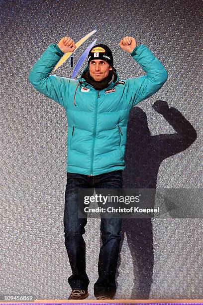 Felix Gottwald of Austria celebrates prior to receiving the bronze medal won in the Nordic Combined Individual 10KM Cross Country race during the FIS...