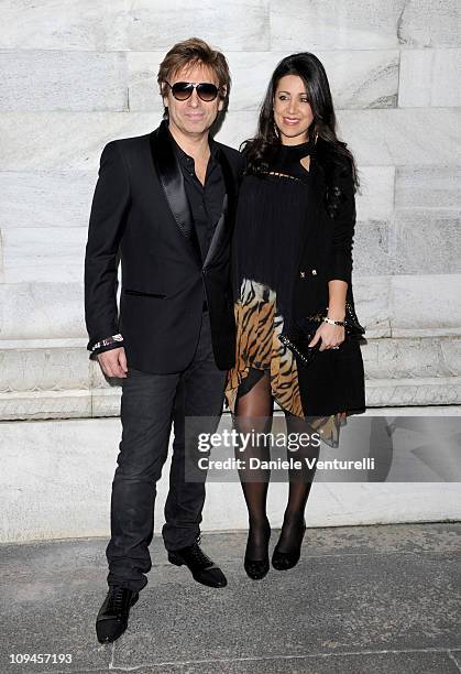 Roger Taylor and Gisella Bernales attend the Roberto Cavalli fashion show as part of Milan Fashion Week Womenswear Autumn/Winter 2011 on February 26,...