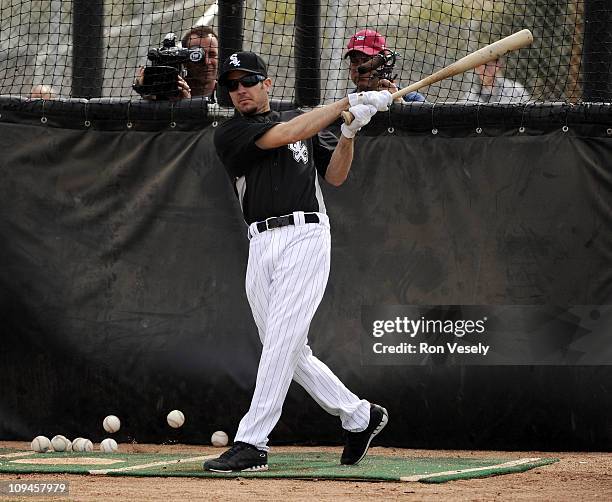 Driver Martin Truex Jr. Takes batting practice with members of the Chicago White Sox during a spring training workout on February 26, 2011 at...