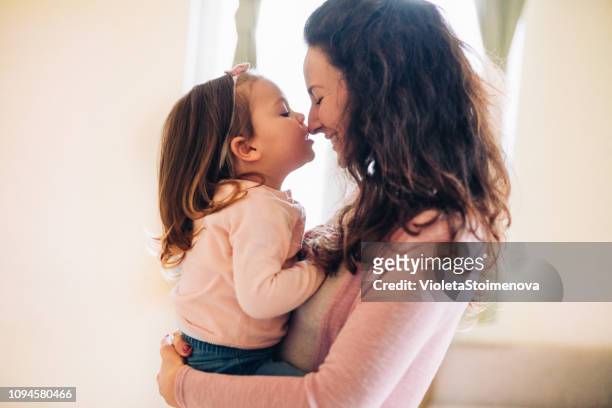 happy mother - hugging daughter stock pictures, royalty-free photos & images