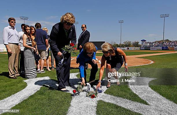 Jessica Steinbrenner, Joan Steinbrenner and Jennifer Steinbrenner Swindal place roses on the Yankee Logo as a tribute to the late George...