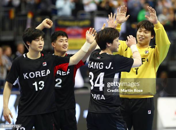 Dongkwang Park, Song Kyiong Ri, Jeongu Kang and Jaeyong Park of Korea celebrates despite getting knocked out after the 26th IHF Men's World...